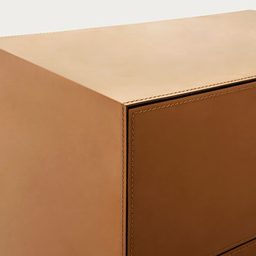 detail of hard leather cover casegood norma Pianca