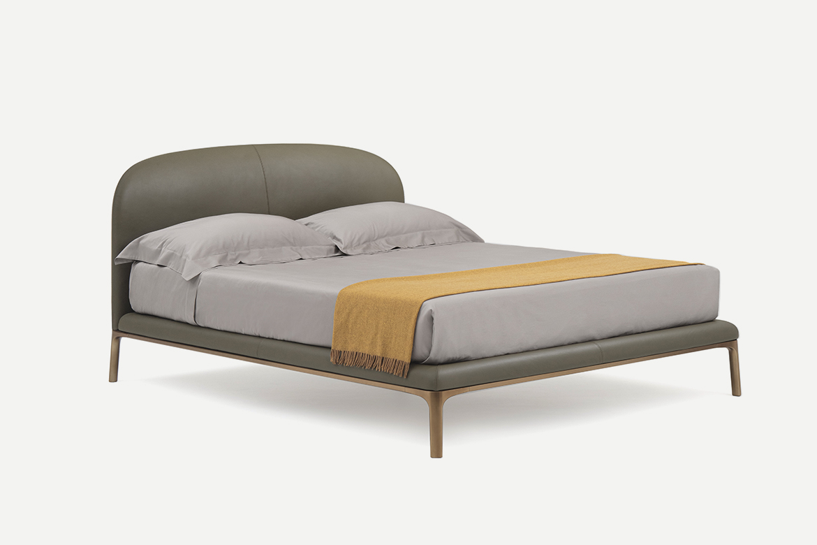 upholstered bed with leather cover and metal legs designed by philippe tabet per pianca