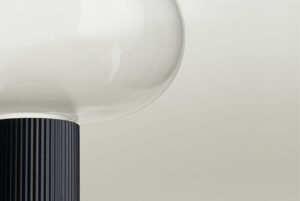 modern lamp designed by Pianca with black structure and glass globe